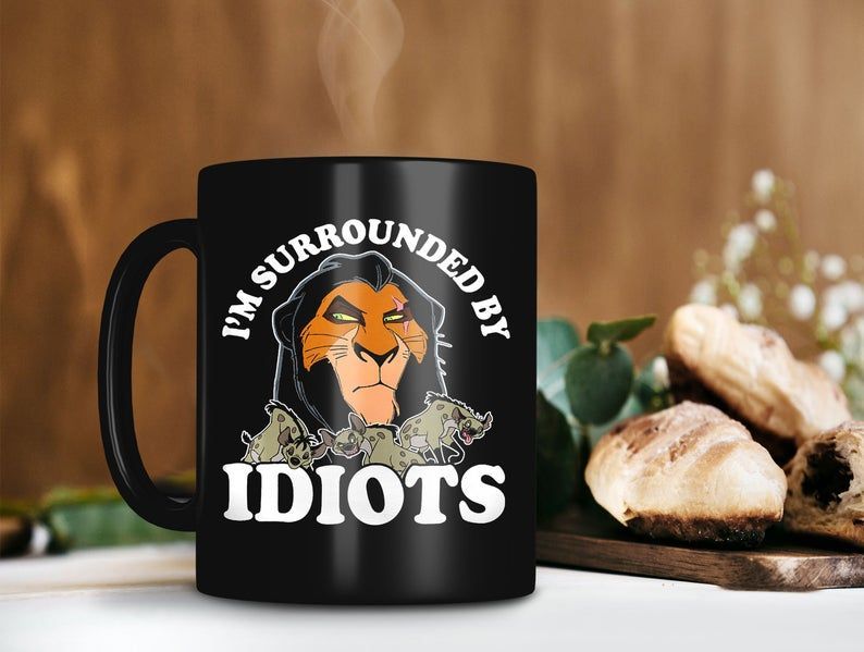 https://teeruto.com/wp-content/uploads/2022/04/im-surrounded-by-idiots-scar-mug-the-lion-king-movie-mug-walt-disney-mug-premium-sublime-ceramic-coffee-mug-blackazfnd.jpg